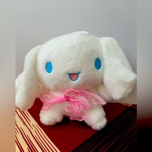 White teddy with pink bow soft toy